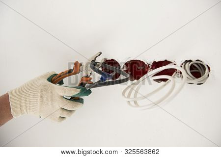 An Electrician Works Hard At The Home Renovation