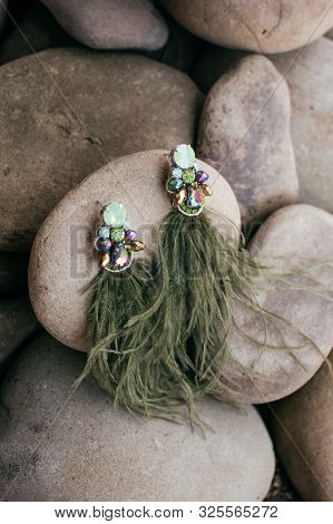 Beautiful Stud Earrings On The Stone. Stock Photo