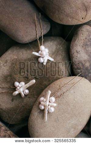Beautiful Stud Earrings On The Stone. Stock Photo