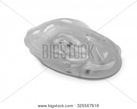 Squeezed cosmetic clear cream gel texture Iisolated on white background. Close up photo of transparent drop of skin care product. High Quality transparent gel with bubbles closeup on white background.