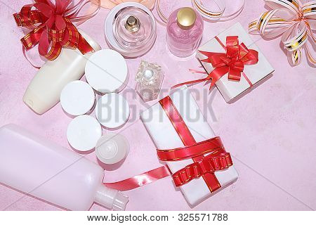 Sale, Black Friday, A Set Of Creams For Skin Care And Gift Bags On A Pink Background, Flat Lay, Top 