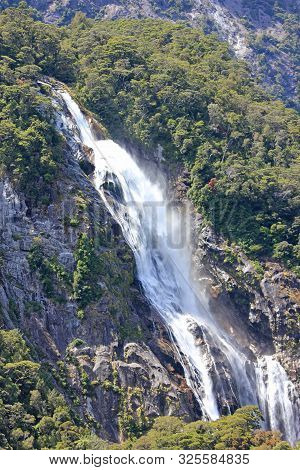 Watefall at milford sound on a beautiful sunny summer day