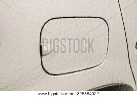 Detail Of Icy Car Body And Fuel Cap After Freezing Rain. Unprotected Outdoor Transportation In Winte