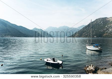 Beautiful View Of The Bay Of Kotor In Montenegro. Natural Mountain Landscape And The Sea. Boats Moor