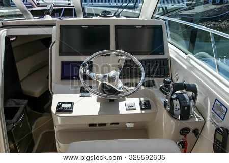 NORWALK, CT, USA - SEPTEMBER 19, 2019:   New 2019 Conquest 345 shoving on Progressive Norwalk Boat Show Day 1 From September 19-22, 2019.