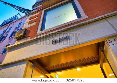VENICE, ITALY - CIRCA MAY, 2019: Farini sign over a restaurant entrance in Venice.