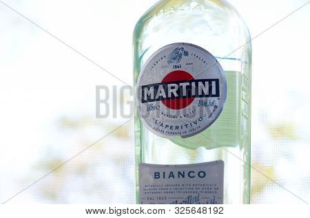Kharkov, Ukraine - September 23, 2019: Bottle Of Vermouth Martini Rossi Close Up Logo On A Green Tre