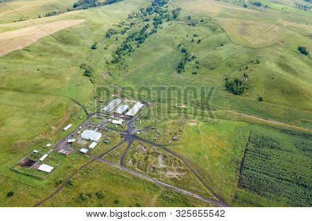 Aerial View Of Livestock Plots And Agricultural Green Fields In Nature In The Altai Mountains With S