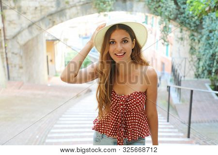 Young Attractive Cheerful Woman Walking In Old Italian City.