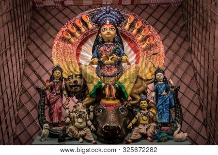 Goddess Durga Idol At Decorated Durga Puja Pandal, Shot At Colored Light, At Kolkata, West Bengal, I