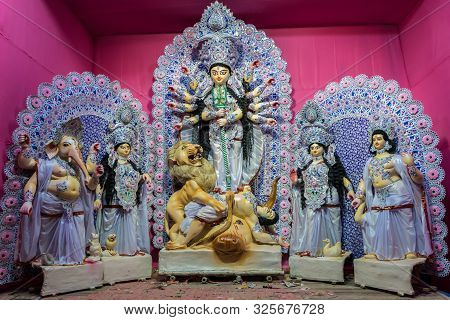 Goddess Durga Idol At Decorated Durga Puja Pandal, Shot At Colored Light, At Kolkata, West Bengal, I