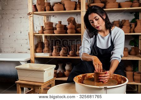 Beautiful Potter Master Woman Molds From Clay Pot In Mastre. Female Student Sculptor Works With Clay