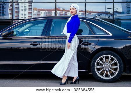 Arab Muslim Business Woman Hijab With Makeup Standing In Front Of Her Luxury Car On The Street On A 