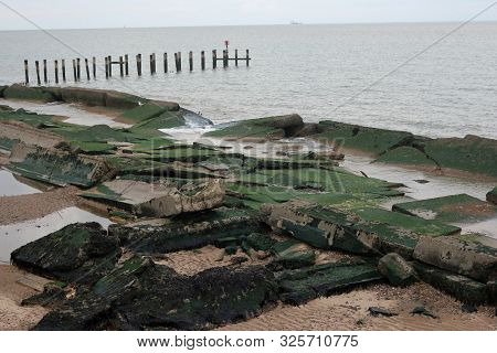 Damaged Concrete Sea Defences On Sandy Beach North Of Lowestoft, Suffolk On England East Coast, Cove