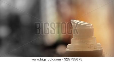 Liquid Bottle Closeup Shot With Colorful Background.