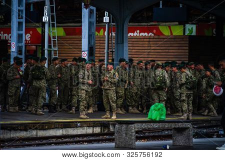 Romanian Soldiers Waiting For A Train On The Platform Of Bucharest North Railway Station (gara De No