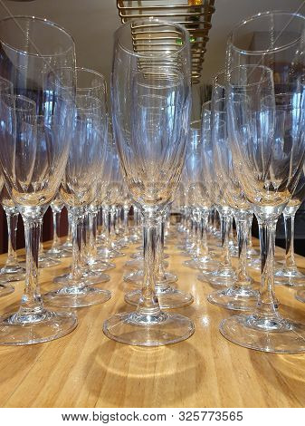 Empty Glasses Of Champagne On The Bar Table.