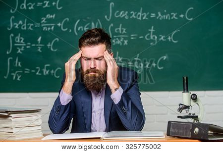 Terrible Headache. Teacher Has Headache. Bearded Man Suffer From Headache. Headache And Migraine. He