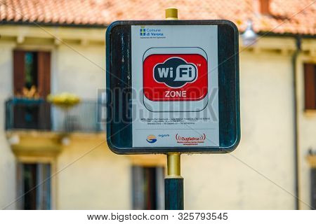 Verona, Italy - July, 08, 2019: Wifi signpost on a street in Verona