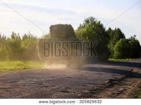 Tractor Driven Fresh Hay Rolled, After Seasonal Harvesting