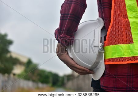Engineer Holding Hard Hat Safety At Work Place And Building Development Estate Heavy Architecture Co