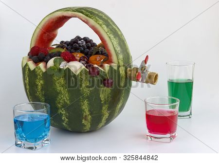 Fruit Basket And Juice Drain Tap. The Basket Is Made Of Watermelon And Filled With Different Fruits