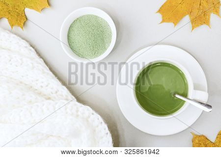 Top View Of Green Tea Matcha In A White Mug. Matcha Ginger Latte. Concept - Healthy Autumn Drinks. C