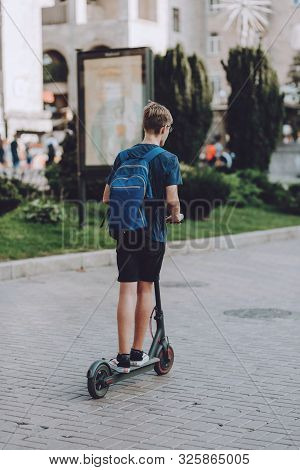 Man On  Solowheel, Electric Scooter, Kick Scooter, Bike Rides On Kiev City Streets. Modern Electric 