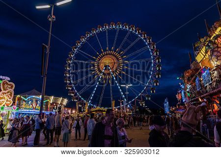 Munich, Germany - 2019, September 24: Visitors From All Over The World Walking In Front Of The Ferri