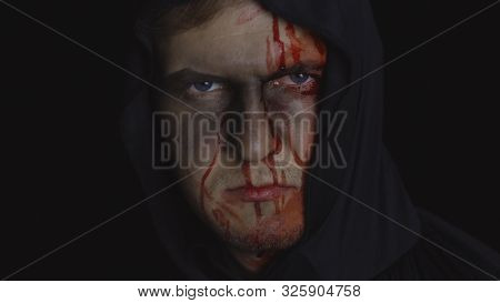 Executioner Halloween Man Portrait. Guy With Dripping Blood On His Face. Executioner, Headman Makeup