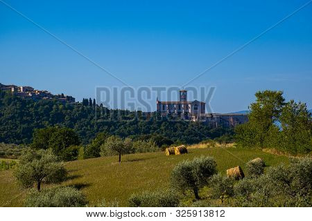 View Of The Basilica Of San Francesco Of Assisi From The Umbrian Hills During A Pilgrim With Road In