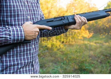 Male With Semi-automated Shotgun In The Autumn Forest Ready To Hunting, Close Up View