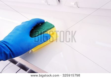 Worker's Hand Wipes Dust And Dirt Indoors. A Maid Or Housewife Takes Care Of The House. Spring Gener