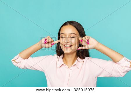 Cheerful Woman Closed Her Ears By Fingers And Laugthing.