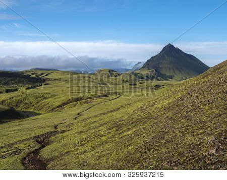 Volcanic Landscape With Footpath Of Laugavegur Trek And Green Storasula Mountain With Lush Moss And 