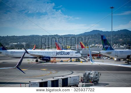 San Francisco, Ca- September 4, 2019: Jet Blue Airplane Ready For Boarding, Viewed From The Glass Wi