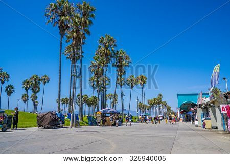 June 10, 2019. Los Angeles, Usa. Venice Beach Broadwalk View In California With Palm Trees And Clear