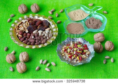 Preparation Of Ashura Dessert. Traditional  Turkish Dessert Noah Pudding, Ashura Or Asure On The Gre