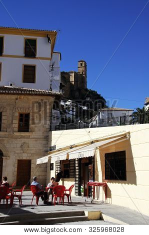 Montefrio, Spain - November 11, 2009 - People Relaxing At A Pavement Cafe In The Town Centre, Montef