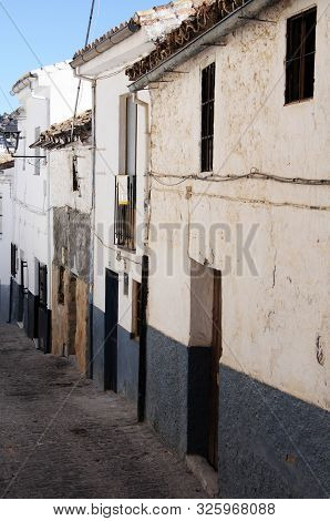 Montefrio, Spain - November 11, 2009 - Traditional Townhouses Along An Old Town Street, Montefrio, G