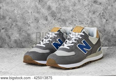 Istanbul, Turkey - June 23, 2021: New Balance Shoes Model 574 On Gray Background.