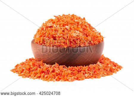 Dry Carrot In Wooden Bowl, Isolated On The White Background. Chopped Dried Carrot. And Herbs.