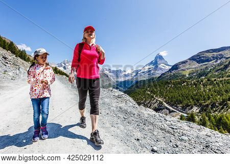 Hiking - Hiker Woman On Trek With Backpack Living Healthy Active Lifestyle. Hiker Girl Walking On Hi