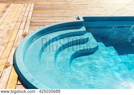 New Modern Fiberglass Plastic Swimming Pool Entrance Step With Clean Fresh Refreshing Blue Water On 