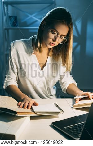 Night Study. Distant Education. Student In Glassess Sitting At Desk Learning Reading Books Preparing