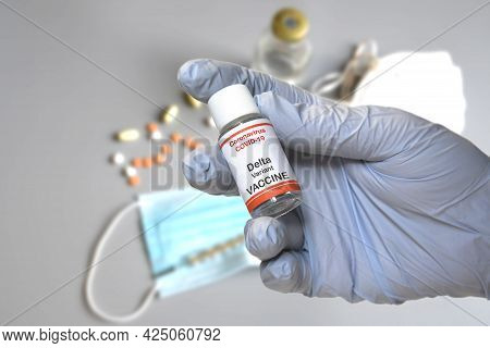 Hand Of Doctor Hold Hypothetical Vial Of Covid-19 Vaccine To Immunize From The Delta Variant Coronav