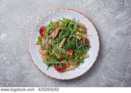 Pasta With Shrimps, Cherry Tomatoes, Arugula Leaves And Onion