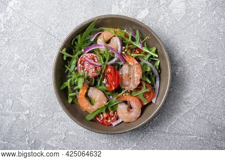 Healthy Salad With Fresh Arugula, Cherry Tomatoes, Tasty Shrimps And Onion