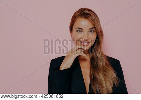 Attractive Office Lady With Long Loose Stright Hair And Healthy Skin. Smiling And Lightly Touches Ch