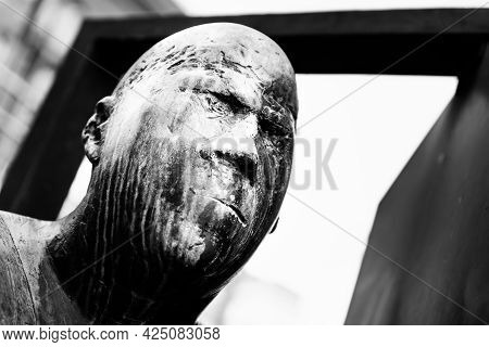 Germany, Luebeck, June 19, 2017, Bronze Statue With The Name, Revolving Door, In The Pedestrian Zone